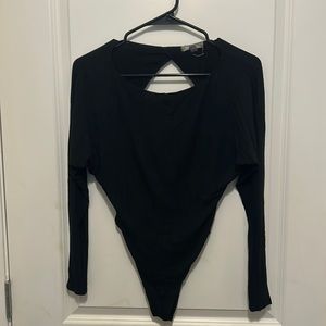 Black Billabong long sleeve bodysuit. Size small.